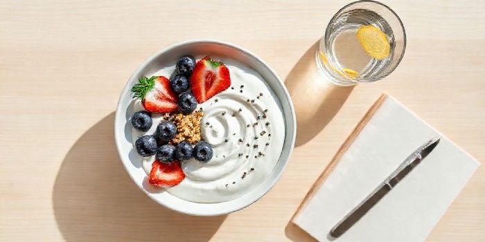 A protein-rich breakfast with yogurt and berries to provide sustained energy levels.