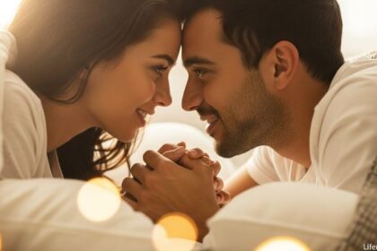 Romantic couple lying in bed face-to-face having intimate conversation before sleep