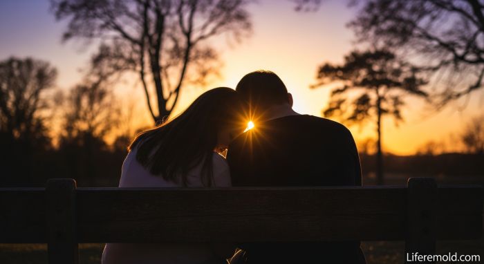Couple showing vulnerability and emotional closeness through intimate moment together